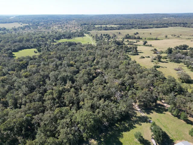 a view of a lake with a yard