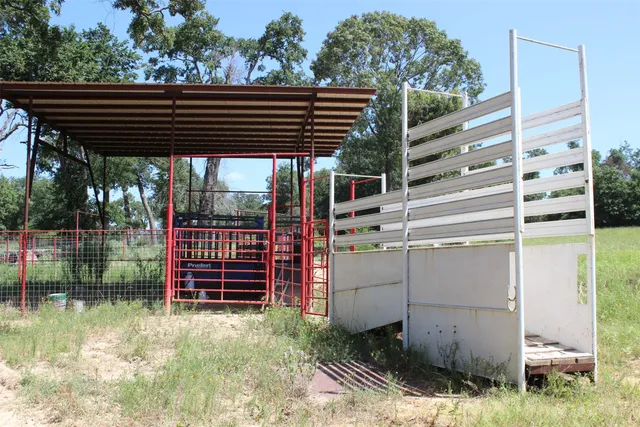 an aerial view of a houses with a yard
