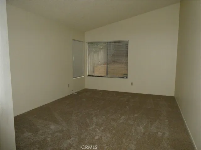 an empty room with a empty space and window