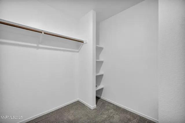 a front view of a house with a road