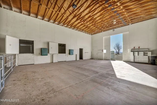 a kitchen with granite countertop a sink cabinets and stainless steel appliances