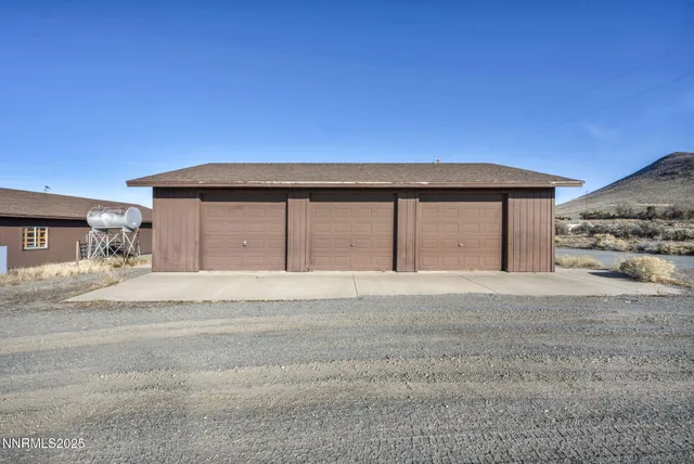 a kitchen with granite countertop a sink a stove and cabinets