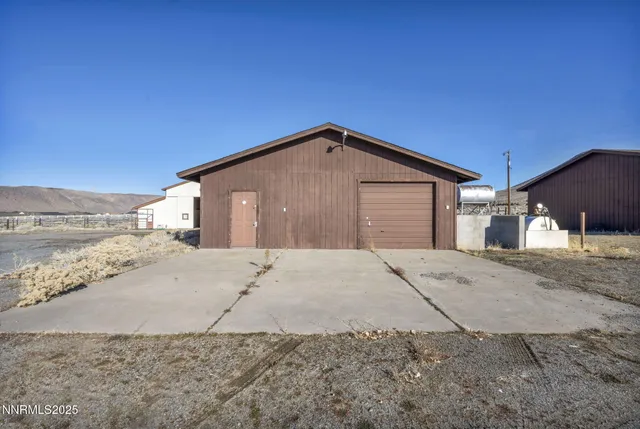 a kitchen with granite countertop a sink a stove and cabinets