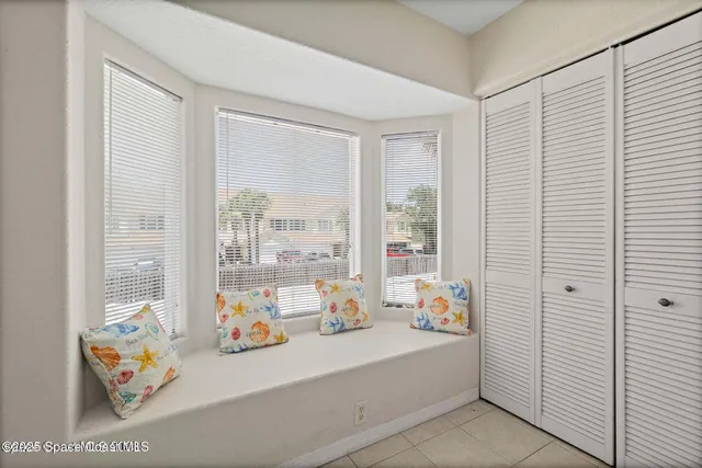 a view of an empty room and window