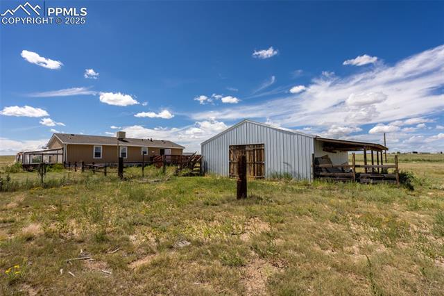 7855 Edison Road Yoder, CO 80864 - Photo 12 of 16 View of Barn & Back of Home