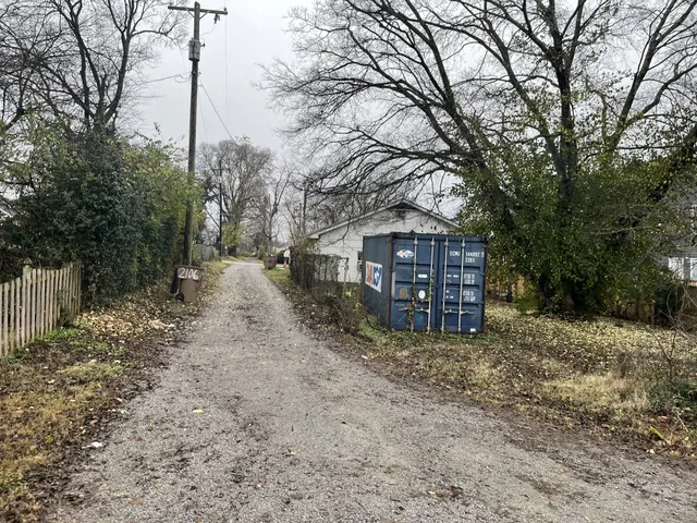 a house that has a tree in front of it