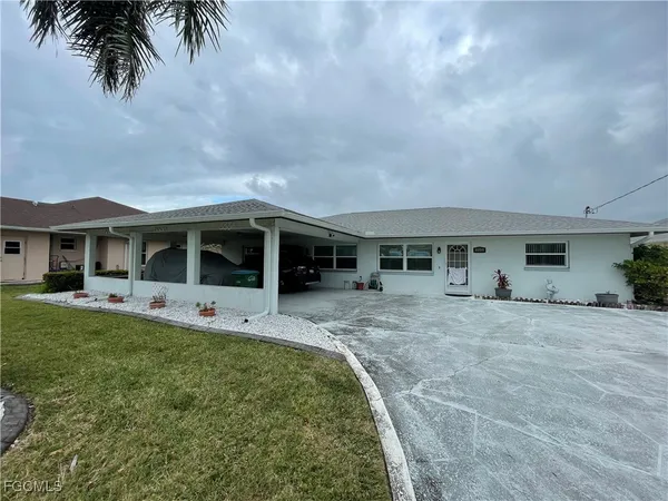 a front view of house with yard and porch
