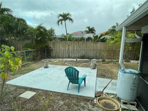 a view of a swimming pool with a patio and a garden