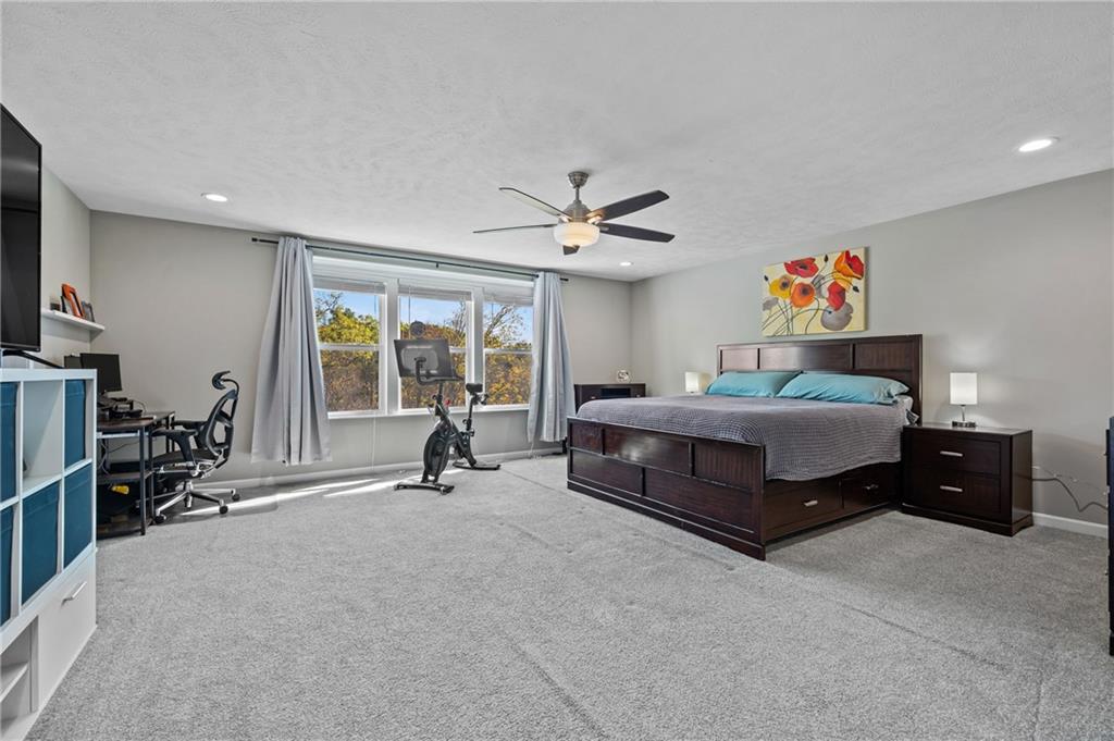 43 Trotter Lane Clinton, PA 15026 - Photo 11 of 34 a spacious bedroom with a bed and a large window