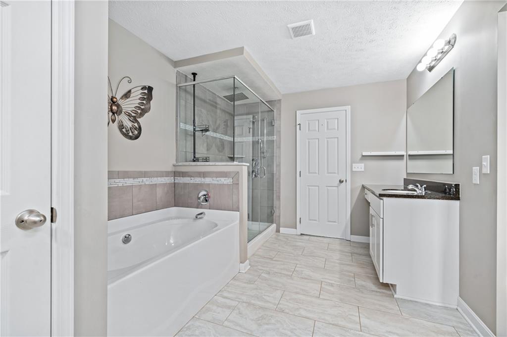 43 Trotter Lane Clinton, PA 15026 - Photo 14 of 34 a bathroom with a bathtub a toilet and a shower