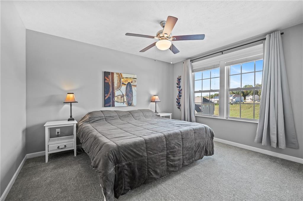 43 Trotter Lane Clinton, PA 15026 - Photo 16 of 34 a bedroom with a bed and a large window