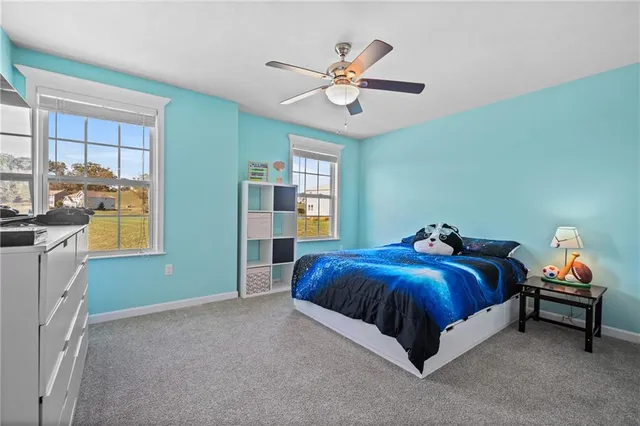 a spacious bedroom with a bed and a table
