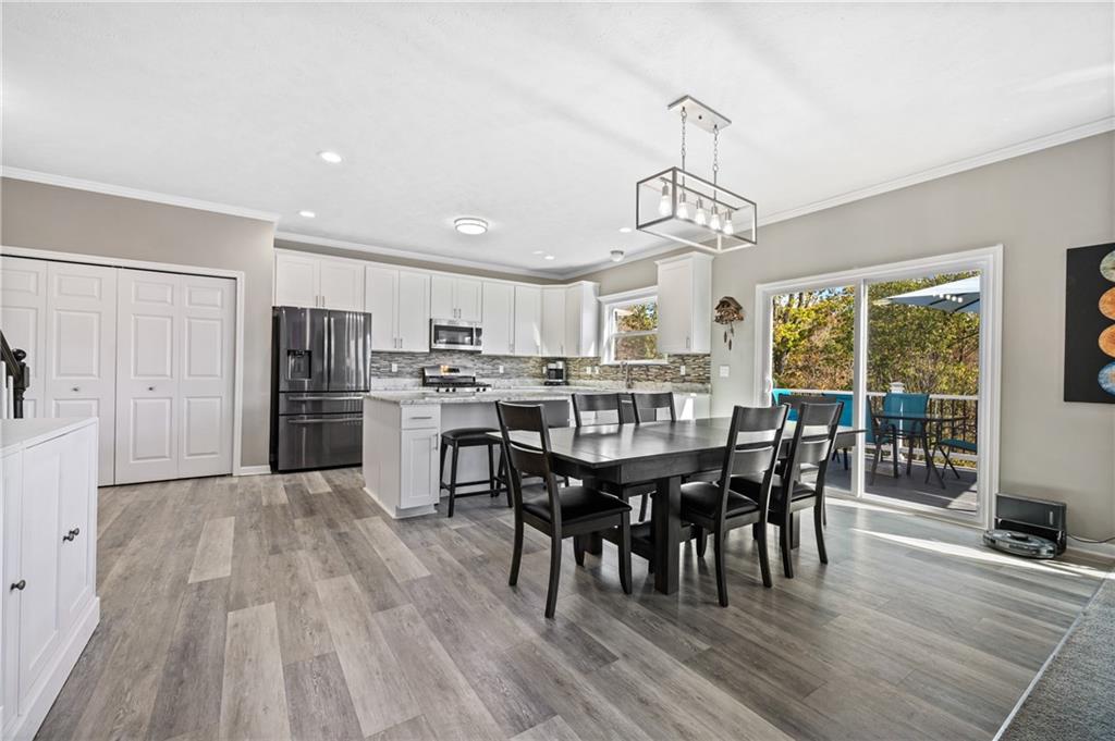 43 Trotter Lane Clinton, PA 15026 - Photo 5 of 34 a view of a dining room with furniture window and wooden floor