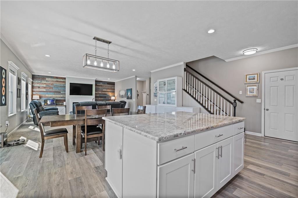 43 Trotter Lane Clinton, PA 15026 - Photo 7 of 34 a view of kitchen island with furniture wooden floor and windows