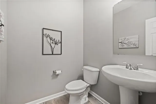 a bathroom with a toilet and a sink