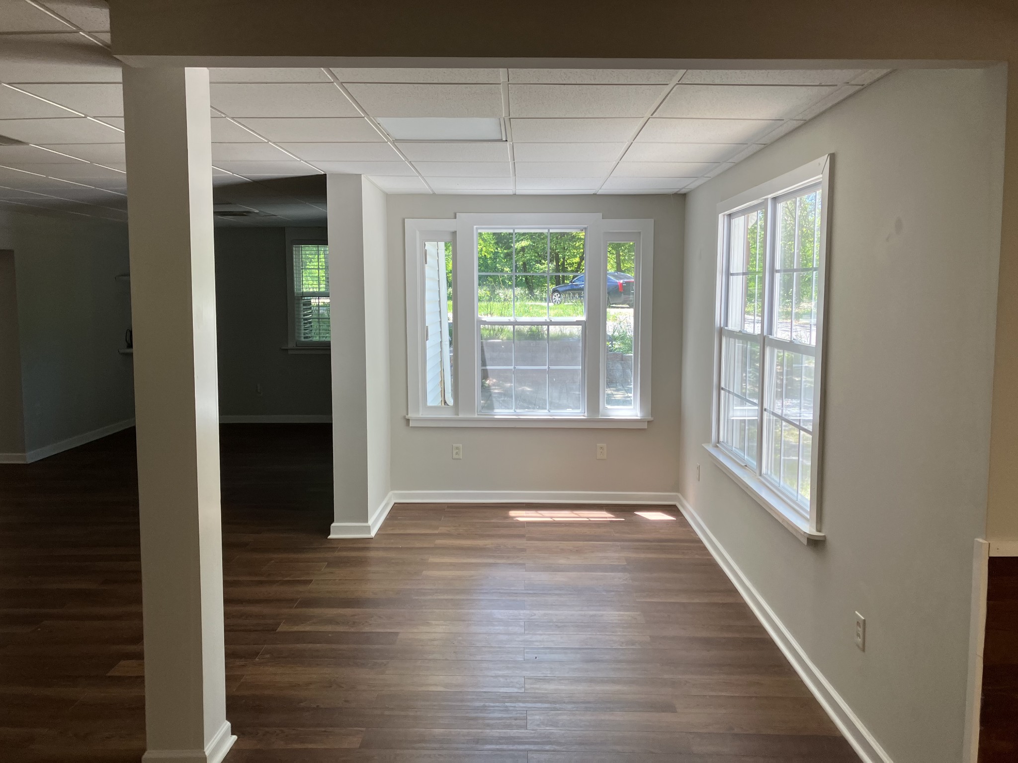 255 S Road Cottontown, TN 37048 - Photo 14 of 35 a view of an empty room with wooden floor and a window
