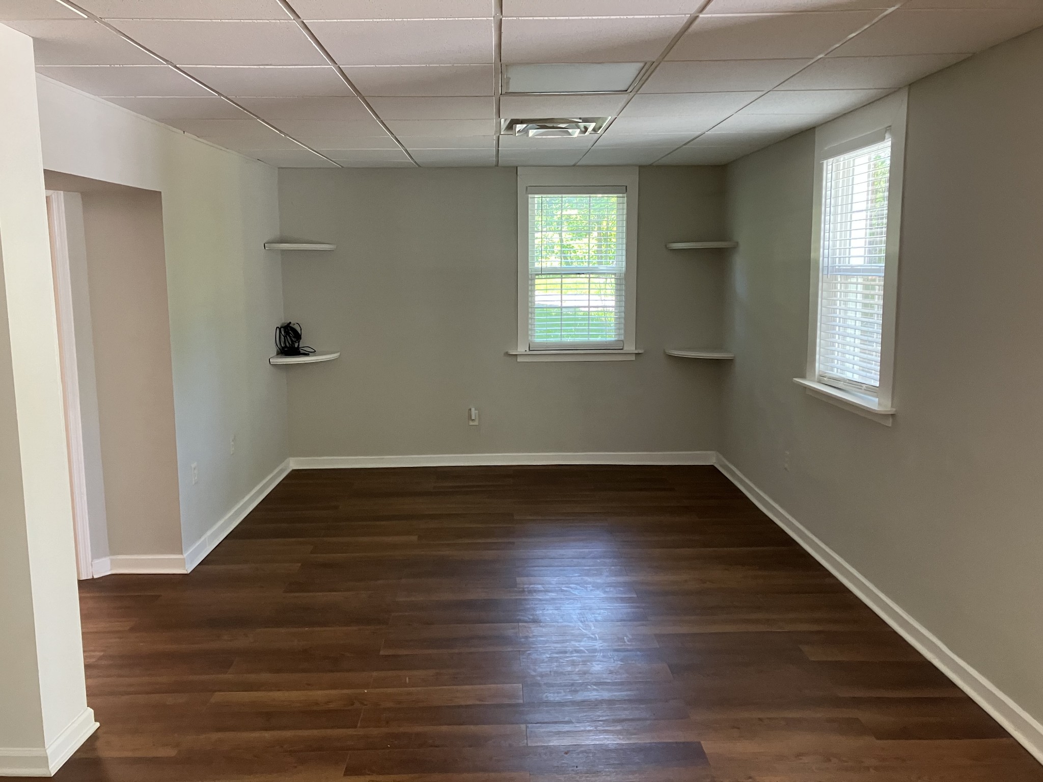 255 S Road Cottontown, TN 37048 - Photo 20 of 35 an empty room with wooden floor and windows