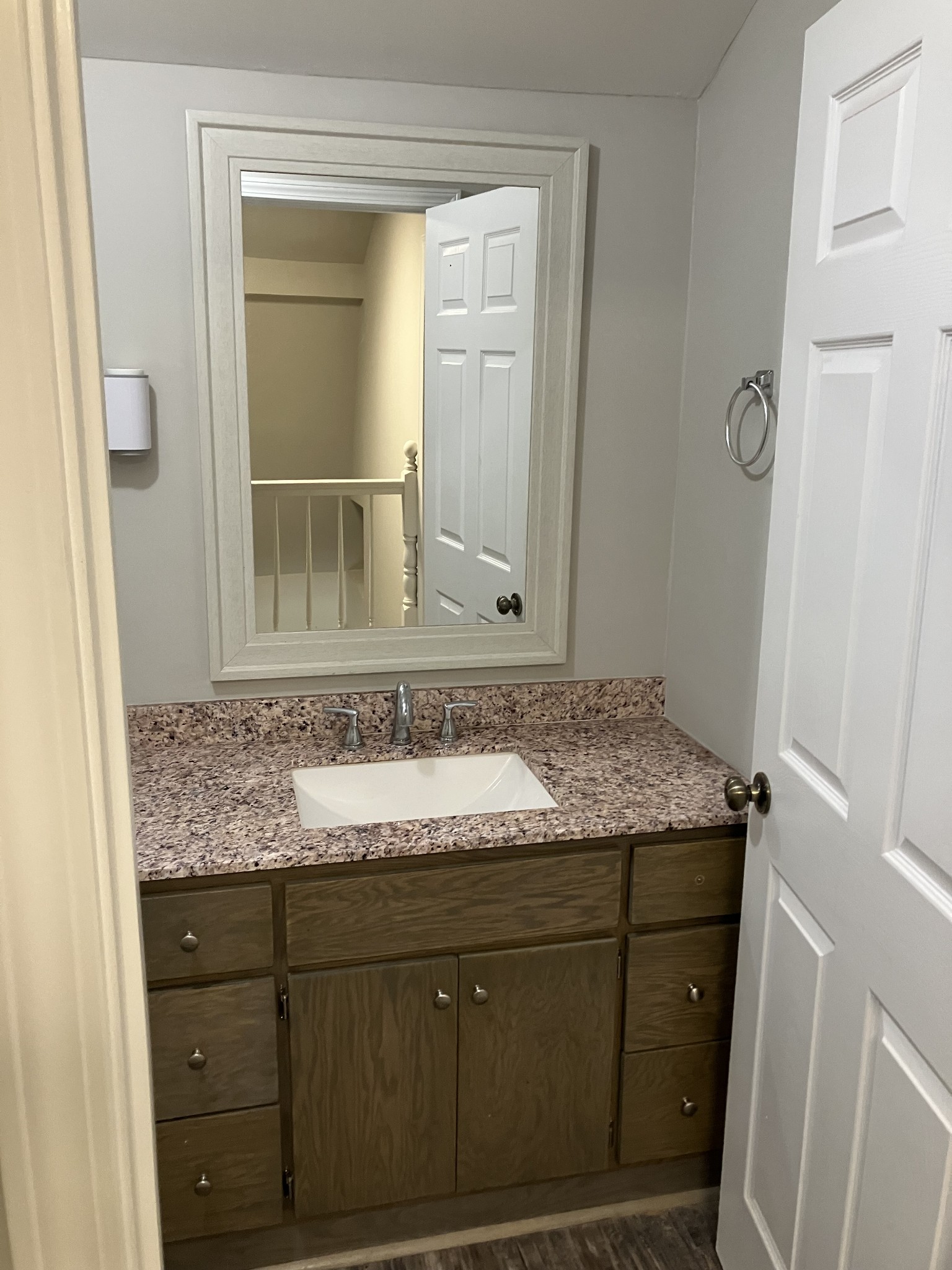 255 S Road Cottontown, TN 37048 - Photo 30 of 35 a bathroom with a granite countertop sink and a mirror
