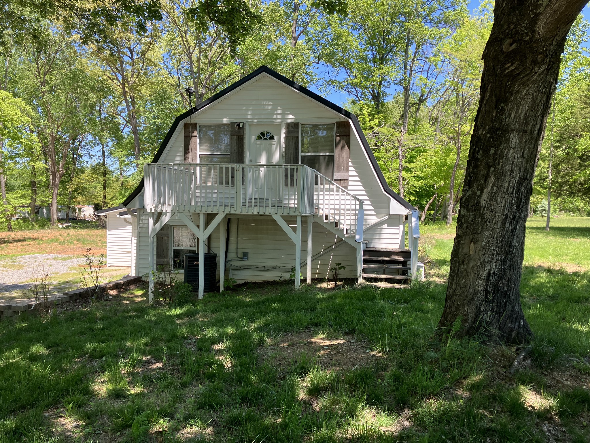 255 S Road Cottontown, TN 37048 - Photo 6 of 35 a front view of a house with a yard