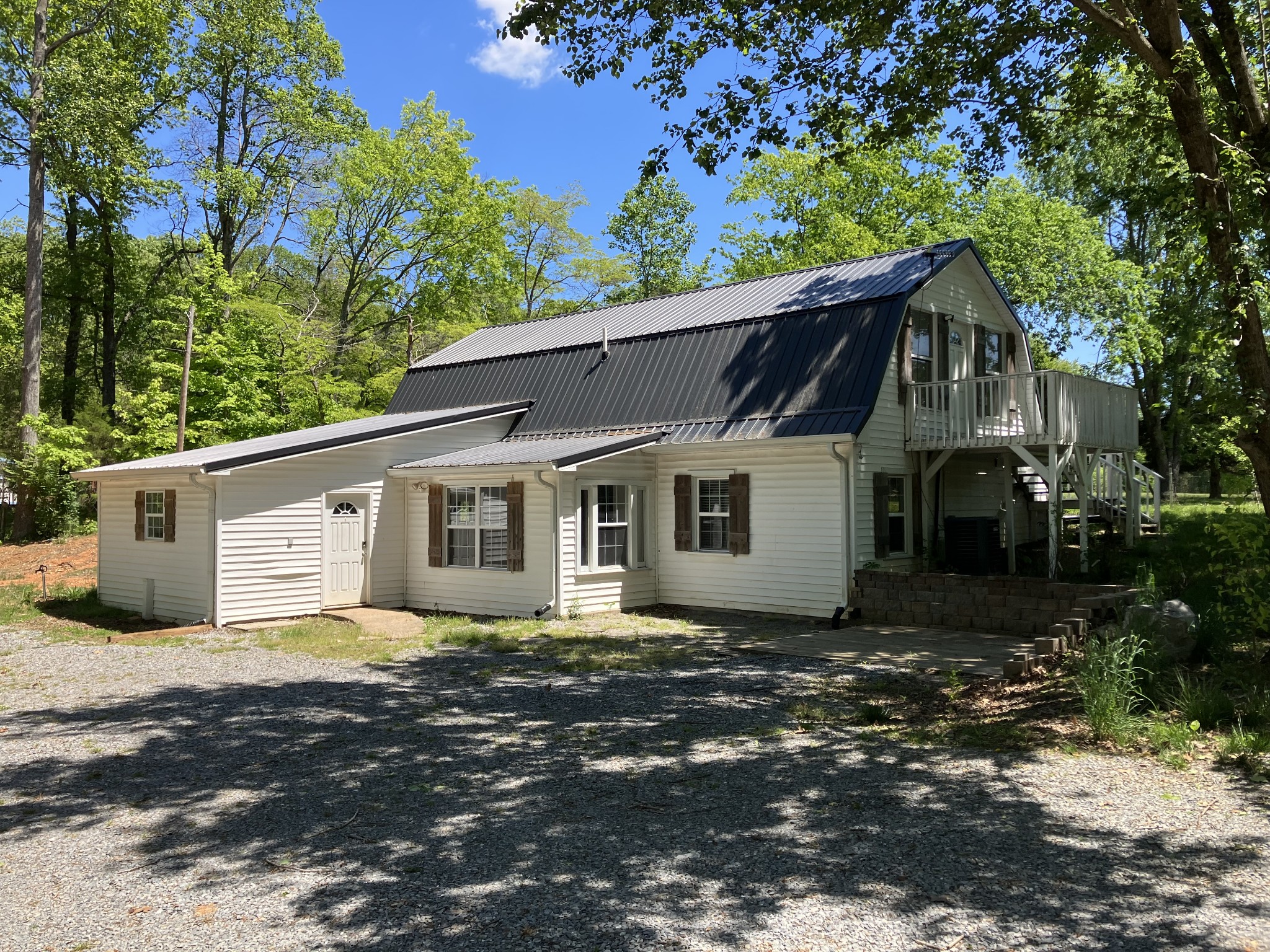 255 S Road Cottontown, TN 37048 - Photo 8 of 35 a front view of a house with a garden