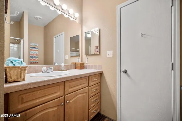 a bathroom with a sink and a mirror