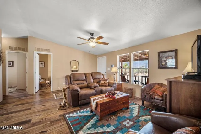 a living room with furniture and a window