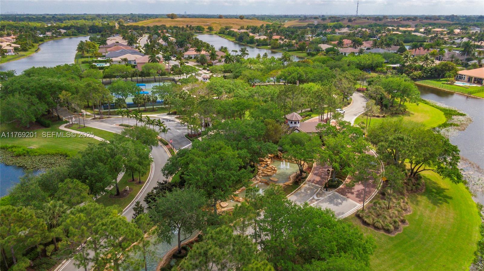 15045 Southwest 37th Street Davie, FL 33331 - Photo 50 of 57 an aerial view of residential houses with outdoor space and trees