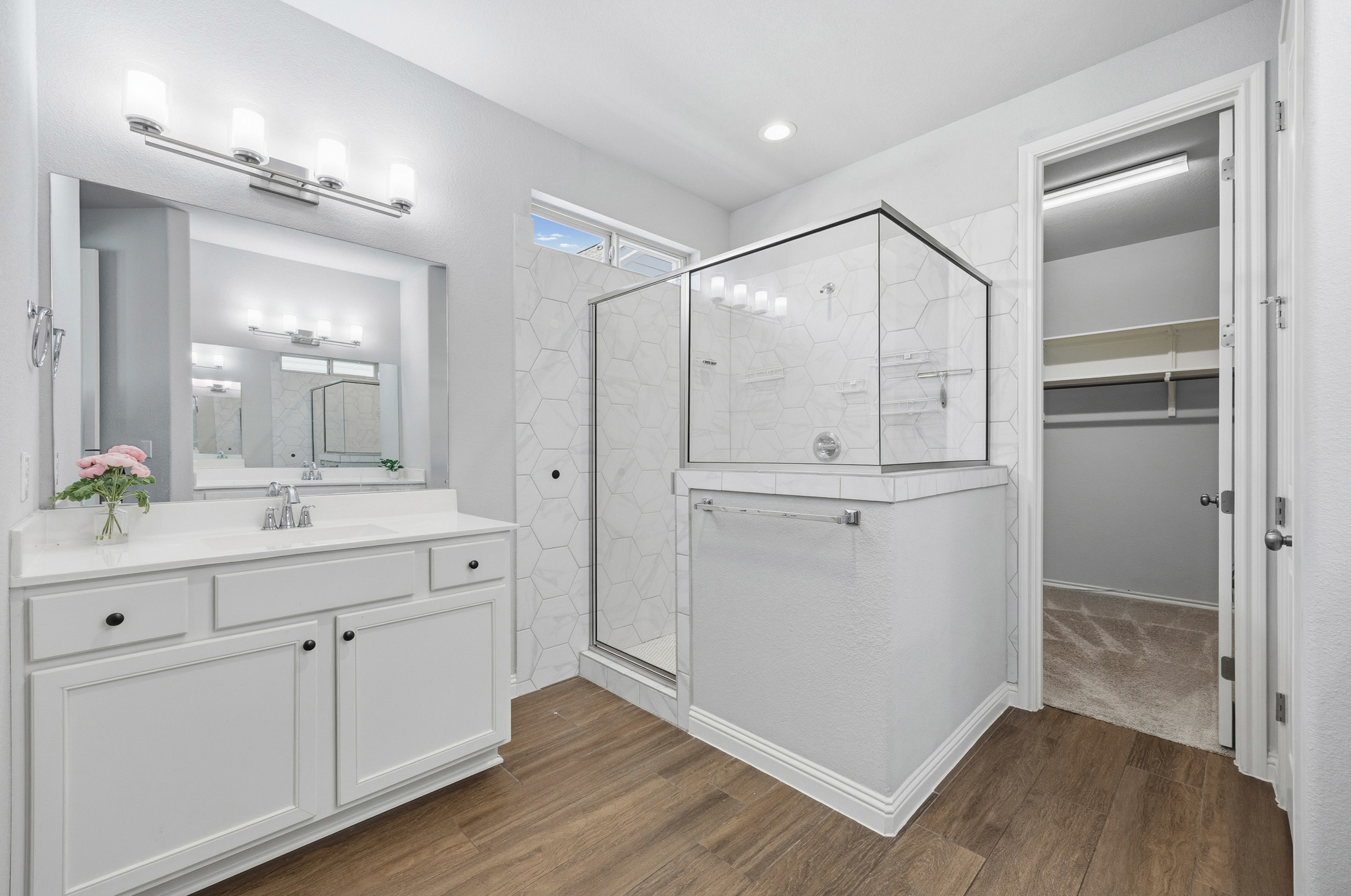 2209 Littleleaf Lane Leander, TX 78641 - Photo 15 of 27 Full bathroom with a marble finish shower, vanity, dark wood-style flooring, a walk in closet, and recessed lighting