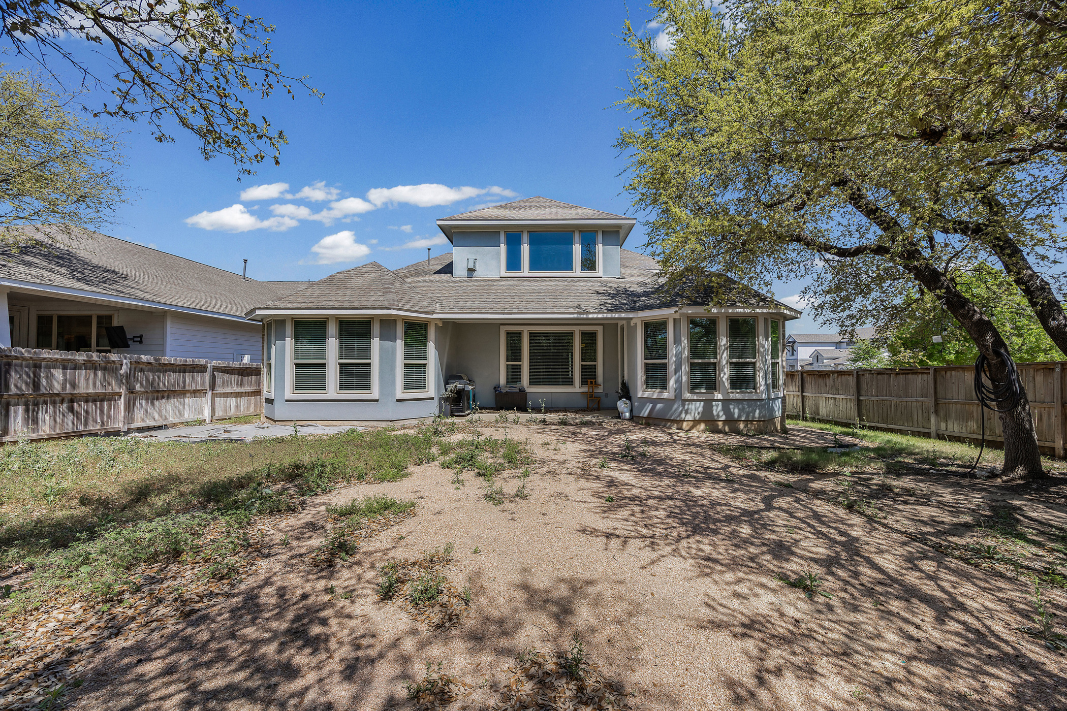 2209 Littleleaf Lane Leander, TX 78641 - Photo 25 of 27 Back of house featuring a fenced backyard, a patio area, and roof with shingles