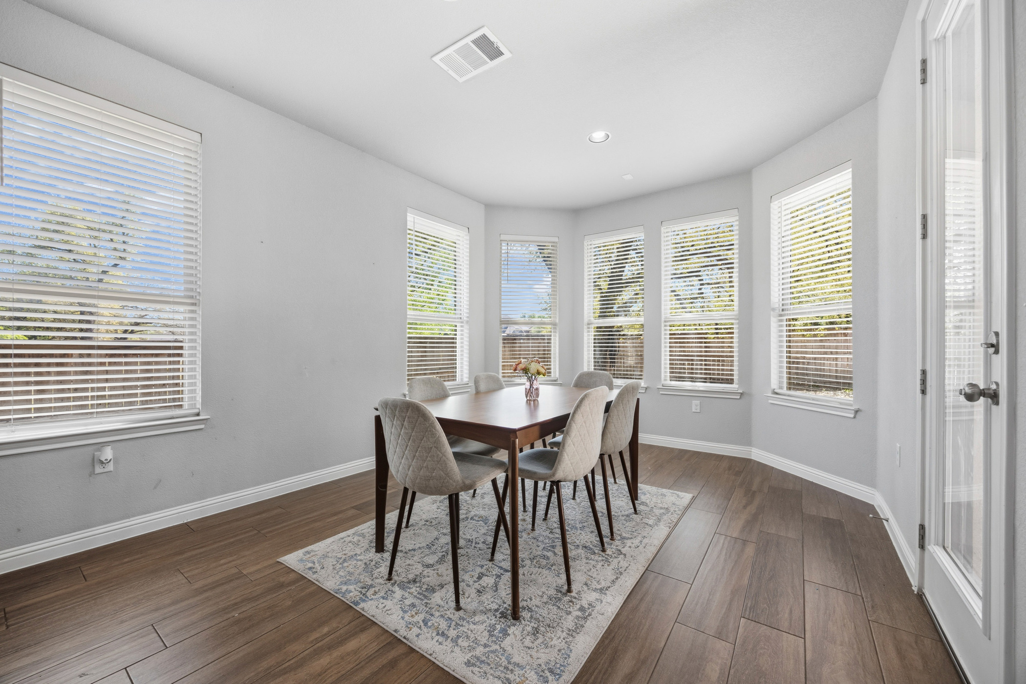 2209 Littleleaf Lane Leander, TX 78641 - Photo 6 of 27 Dining room with dark wood-style floors, plenty of natural light, and recessed lighting