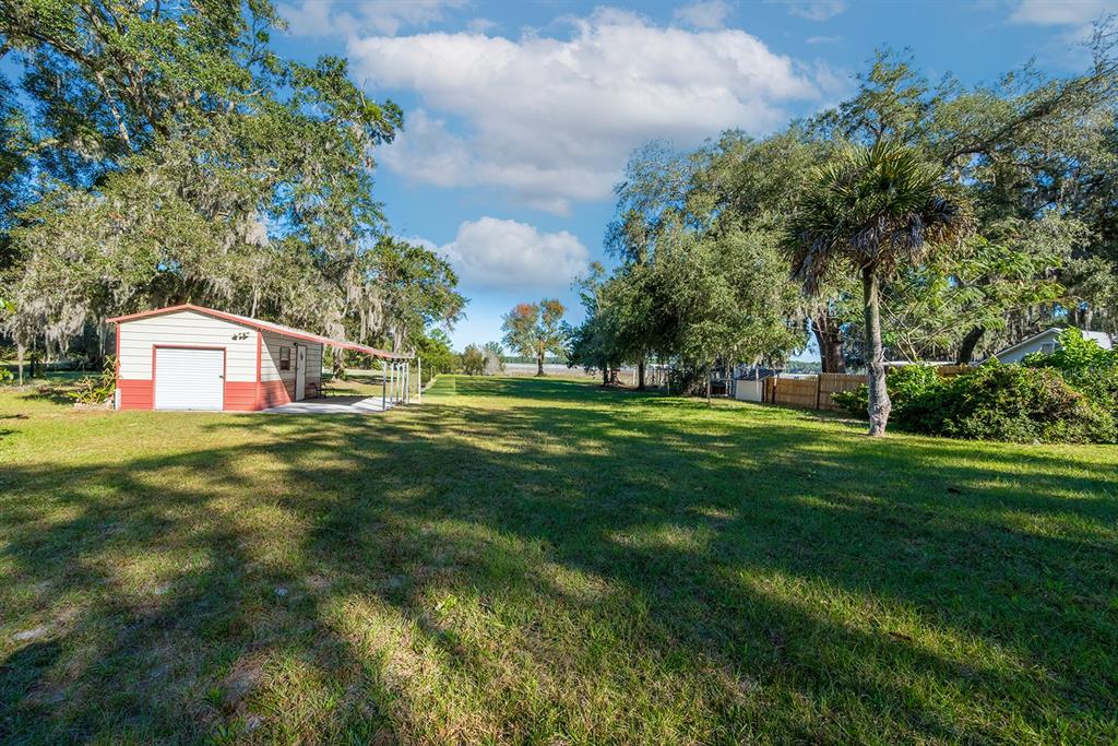 6306 Baker Road Keystone Heights, FL 32656 - Photo 11 of 53 a front view of a house with yard and green space