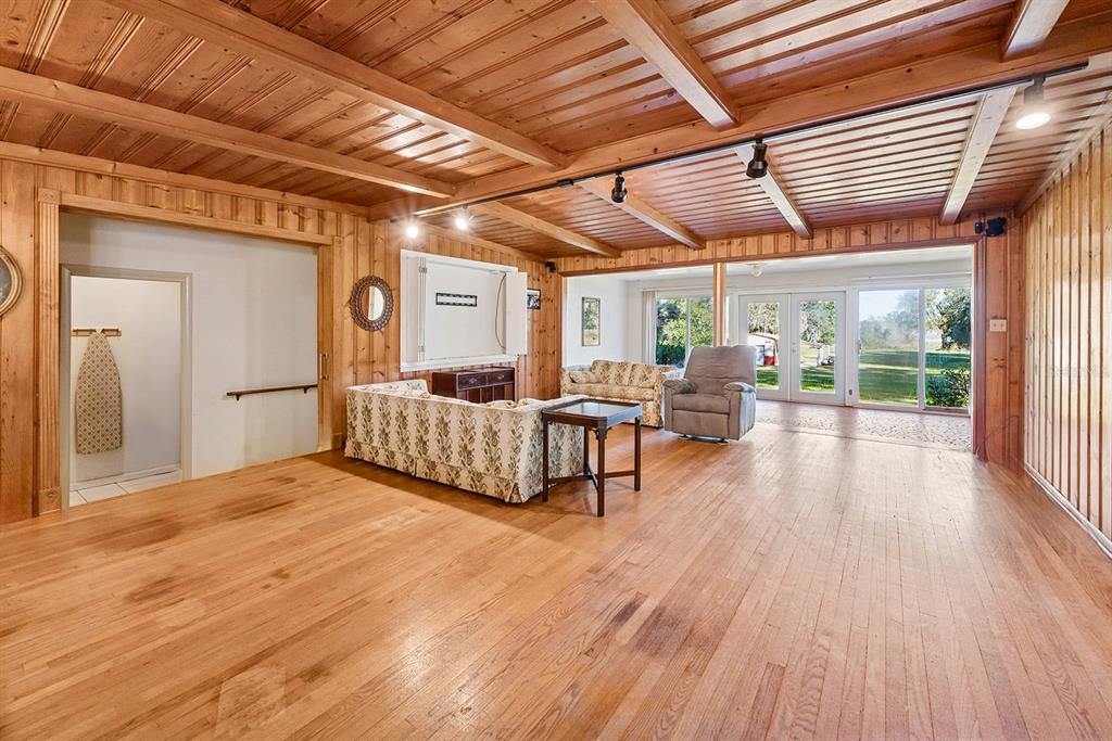 6306 Baker Road Keystone Heights, FL 32656 - Photo 31 of 53 a living room with furniture a wooden floor and next to a window