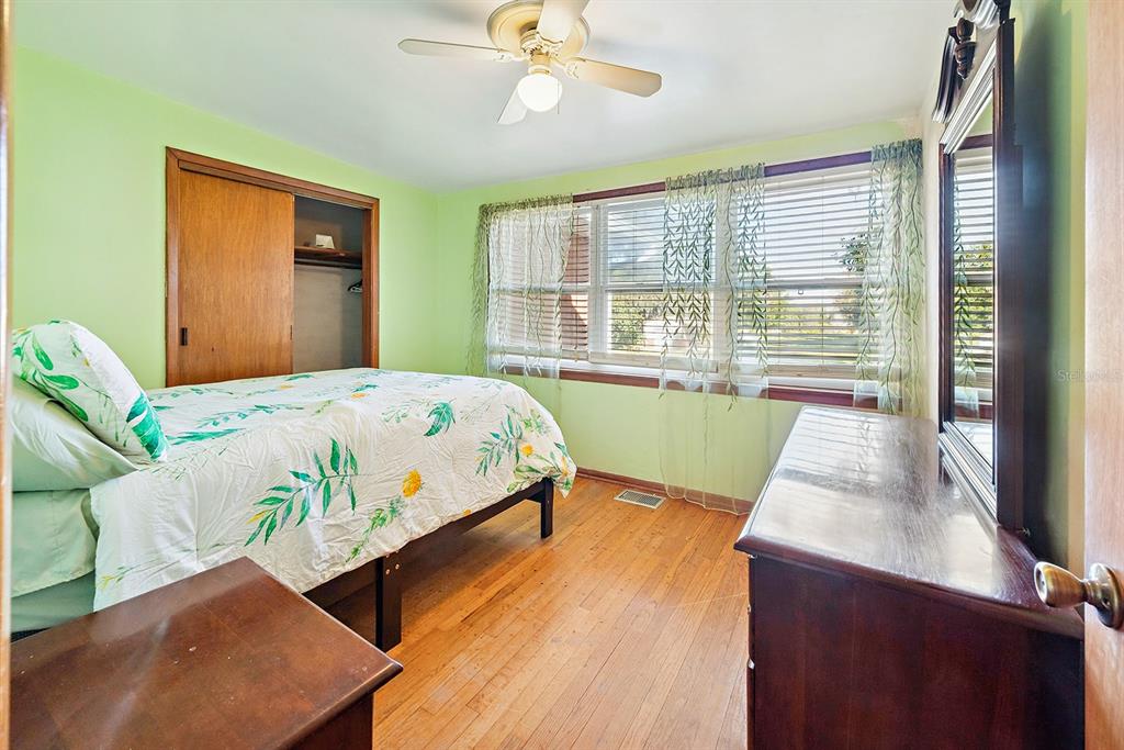 6306 Baker Road Keystone Heights, FL 32656 - Photo 42 of 53 a bed sitting in a bedroom next to a window