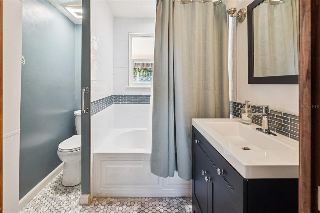 6306 Baker Road Keystone Heights, FL 32656 - Photo 44 of 53 a bathroom with a sink toilet and shower