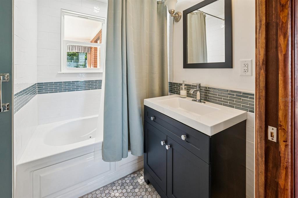 6306 Baker Road Keystone Heights, FL 32656 - Photo 45 of 53 a bathroom with a sink and a mirror