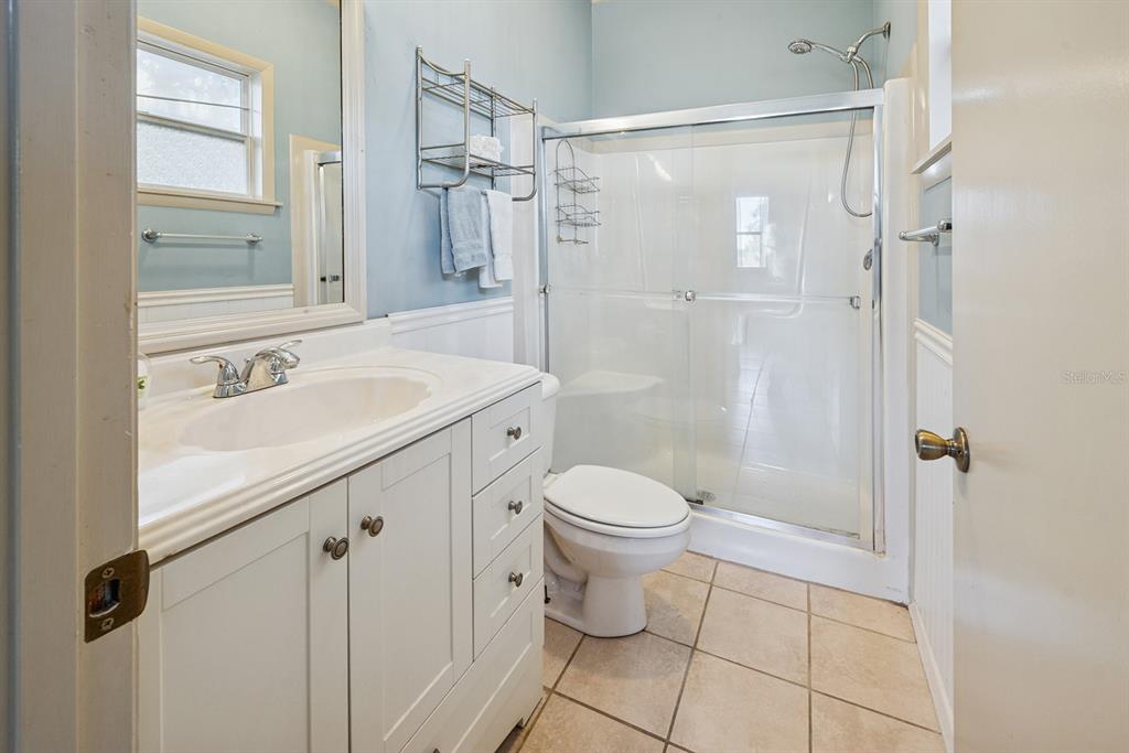 6306 Baker Road Keystone Heights, FL 32656 - Photo 51 of 53 a bathroom with a sink a toilet and shower