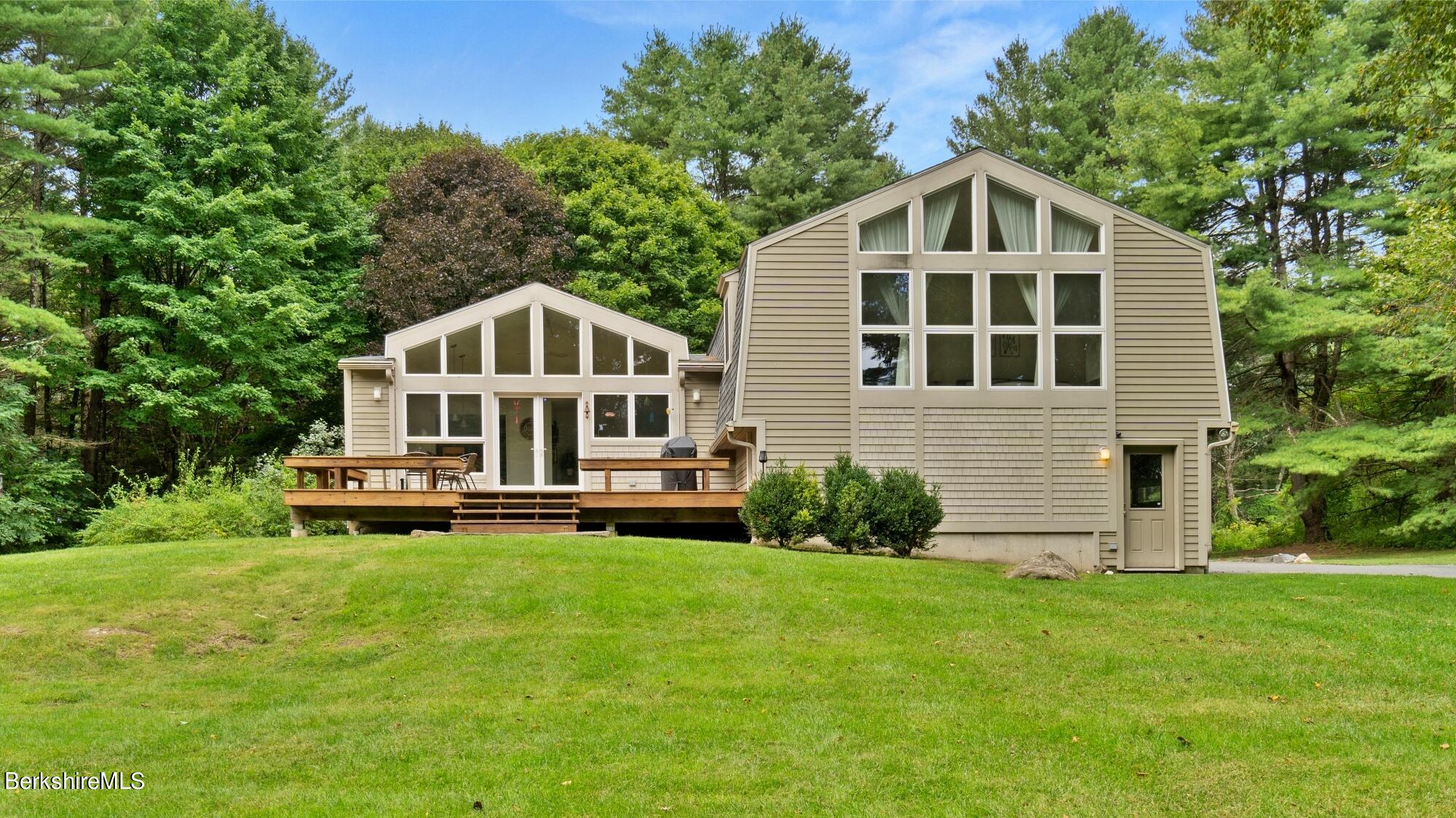 16 Squaw Peak Road Great Barrington, MA 01230 - Photo 1 of 38 a front view of a house with a yard