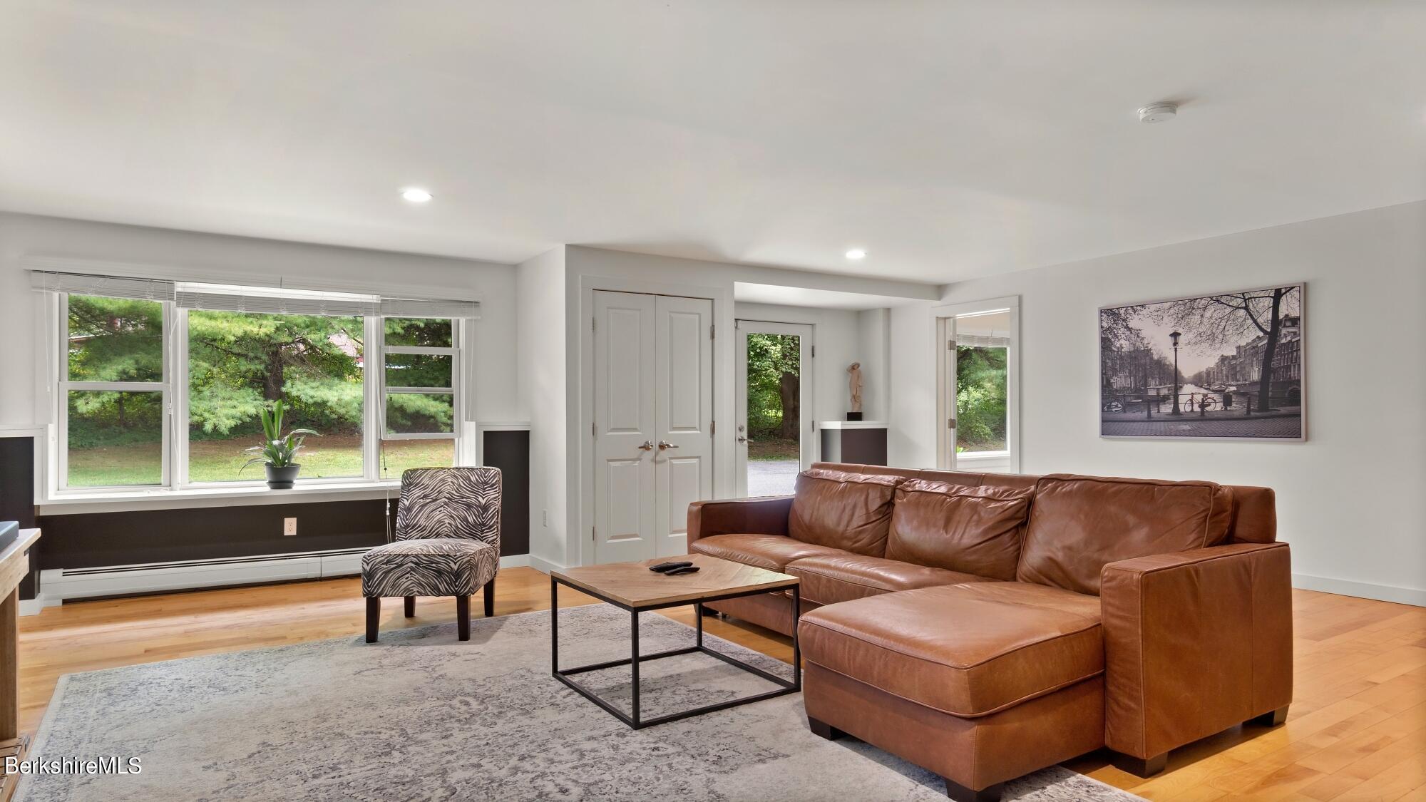16 Squaw Peak Road Great Barrington, MA 01230 - Photo 15 of 38 a living room with furniture and a large window