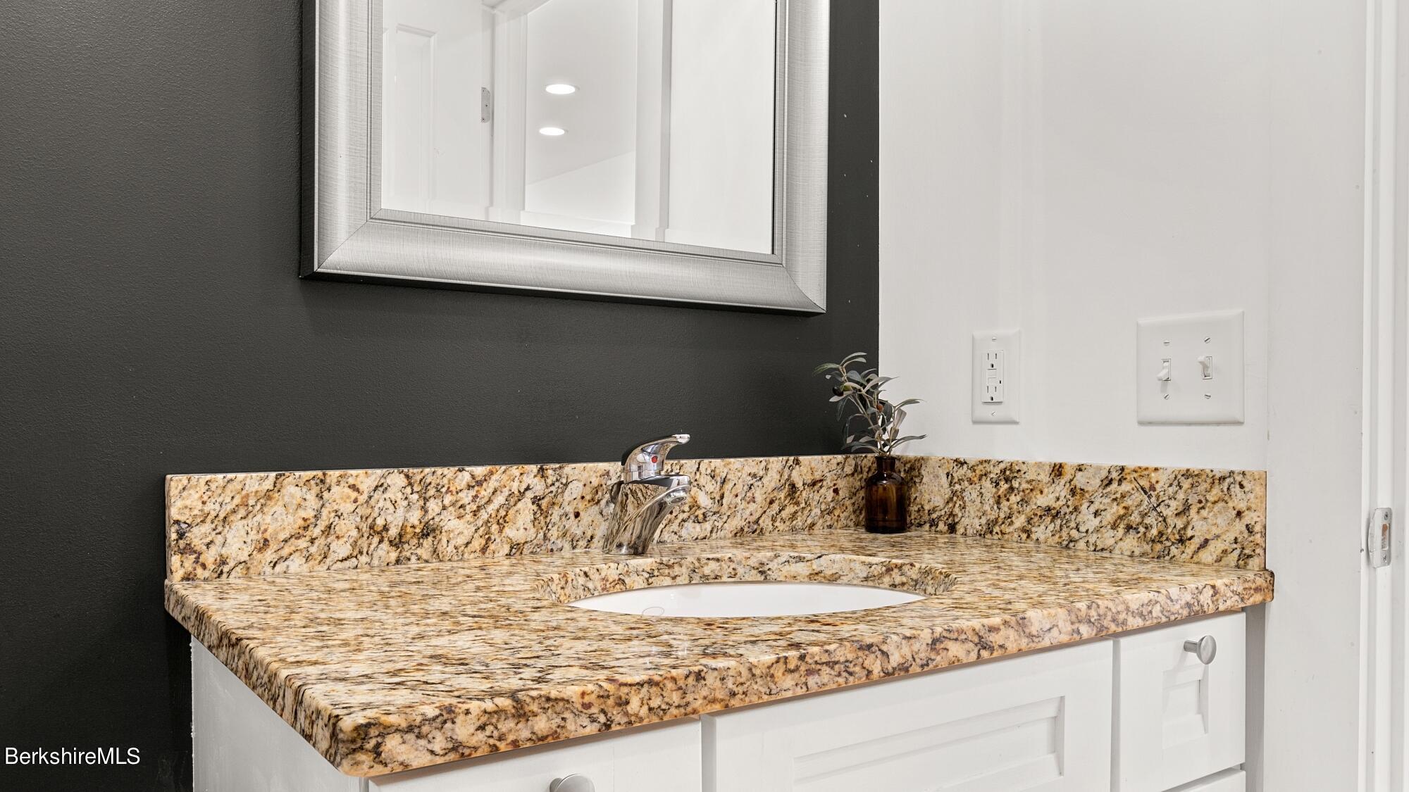 16 Squaw Peak Road Great Barrington, MA 01230 - Photo 18 of 38 a view of kitchen island with granite countertop white cabinets