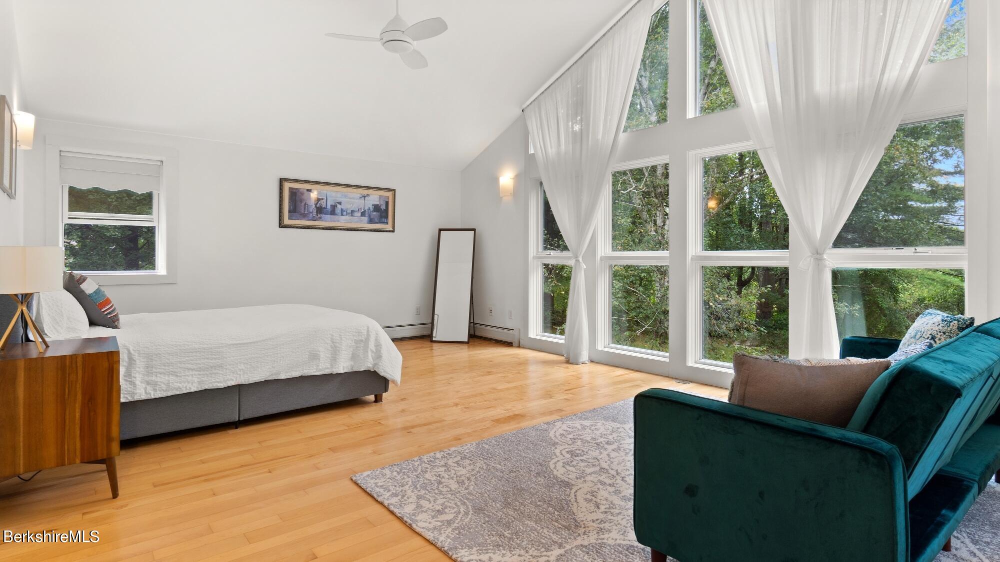 16 Squaw Peak Road Great Barrington, MA 01230 - Photo 19 of 38 a bedroom with a bed and a large window