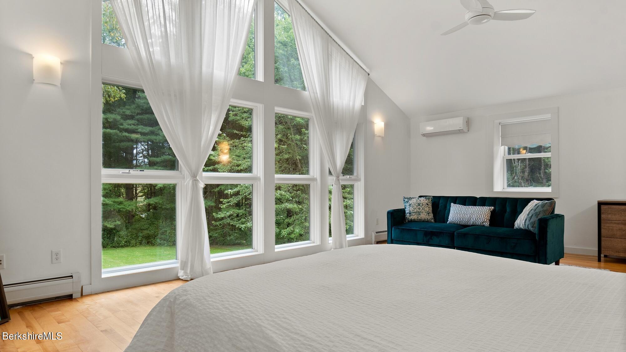 16 Squaw Peak Road Great Barrington, MA 01230 - Photo 21 of 38 a bedroom with a large bed and a large window