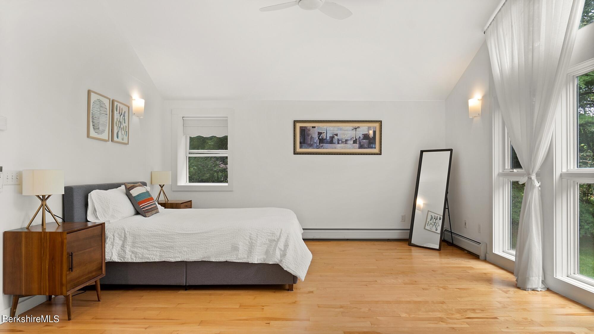 16 Squaw Peak Road Great Barrington, MA 01230 - Photo 22 of 38 a bedroom with a bed and a couch