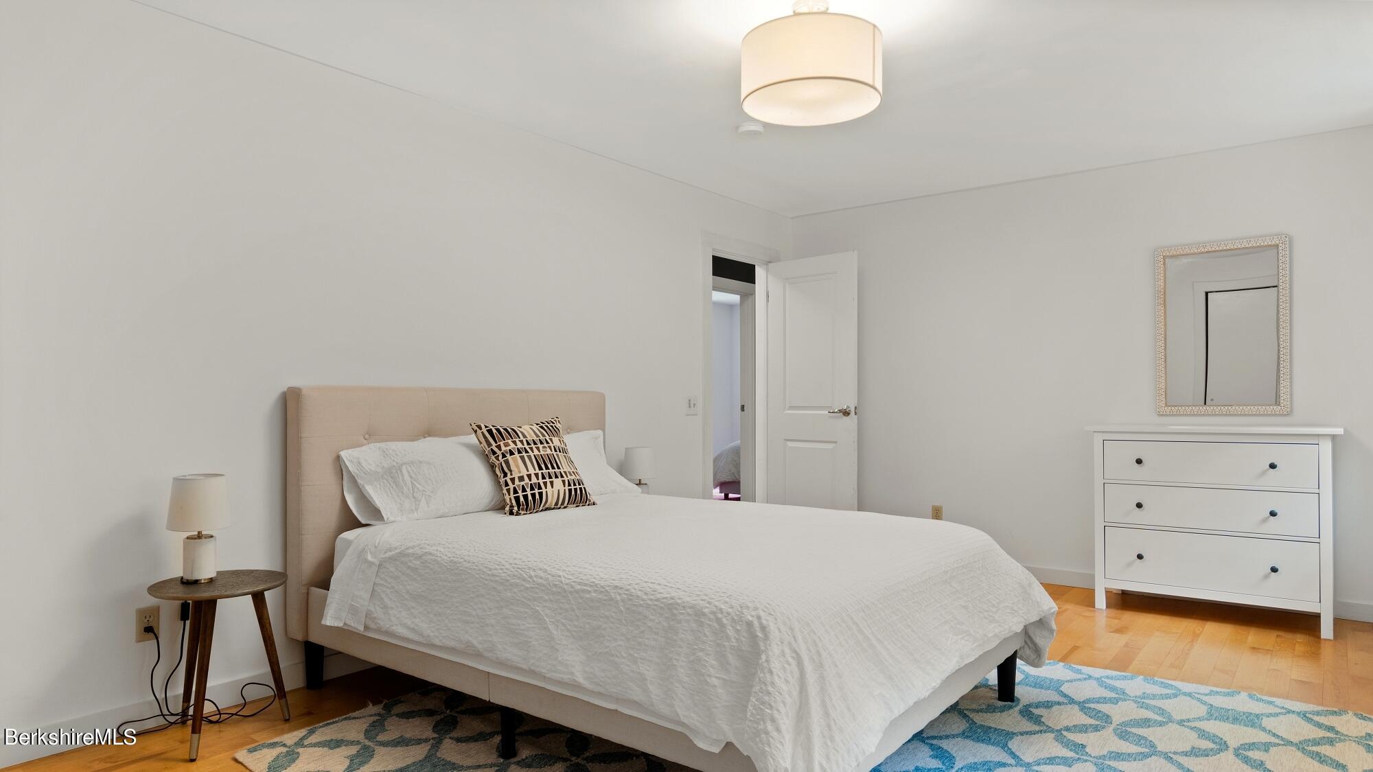 16 Squaw Peak Road Great Barrington, MA 01230 - Photo 25 of 38 a bedroom with a bed and a dresser