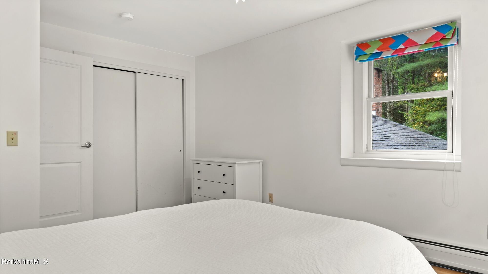 16 Squaw Peak Road Great Barrington, MA 01230 - Photo 27 of 38 a bedroom with a bed and a window