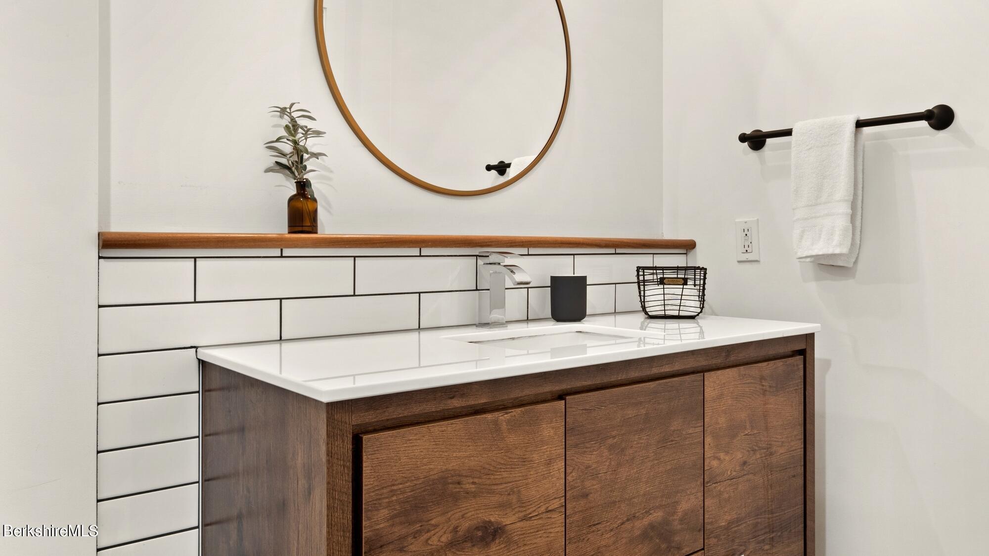 16 Squaw Peak Road Great Barrington, MA 01230 - Photo 29 of 38 a bathroom with a sink and a mirror