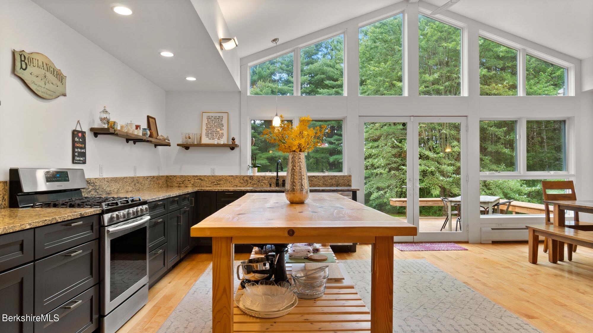 16 Squaw Peak Road Great Barrington, MA 01230 - Photo 4 of 38 a kitchen with a stove a sink and a refrigerator