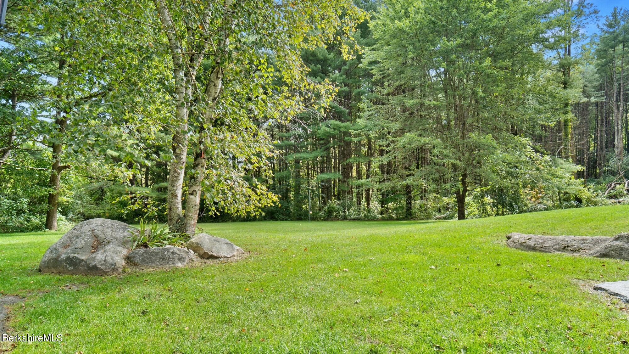 16 Squaw Peak Road Great Barrington, MA 01230 - Photo 35 of 38 a view of a grassy field with trees