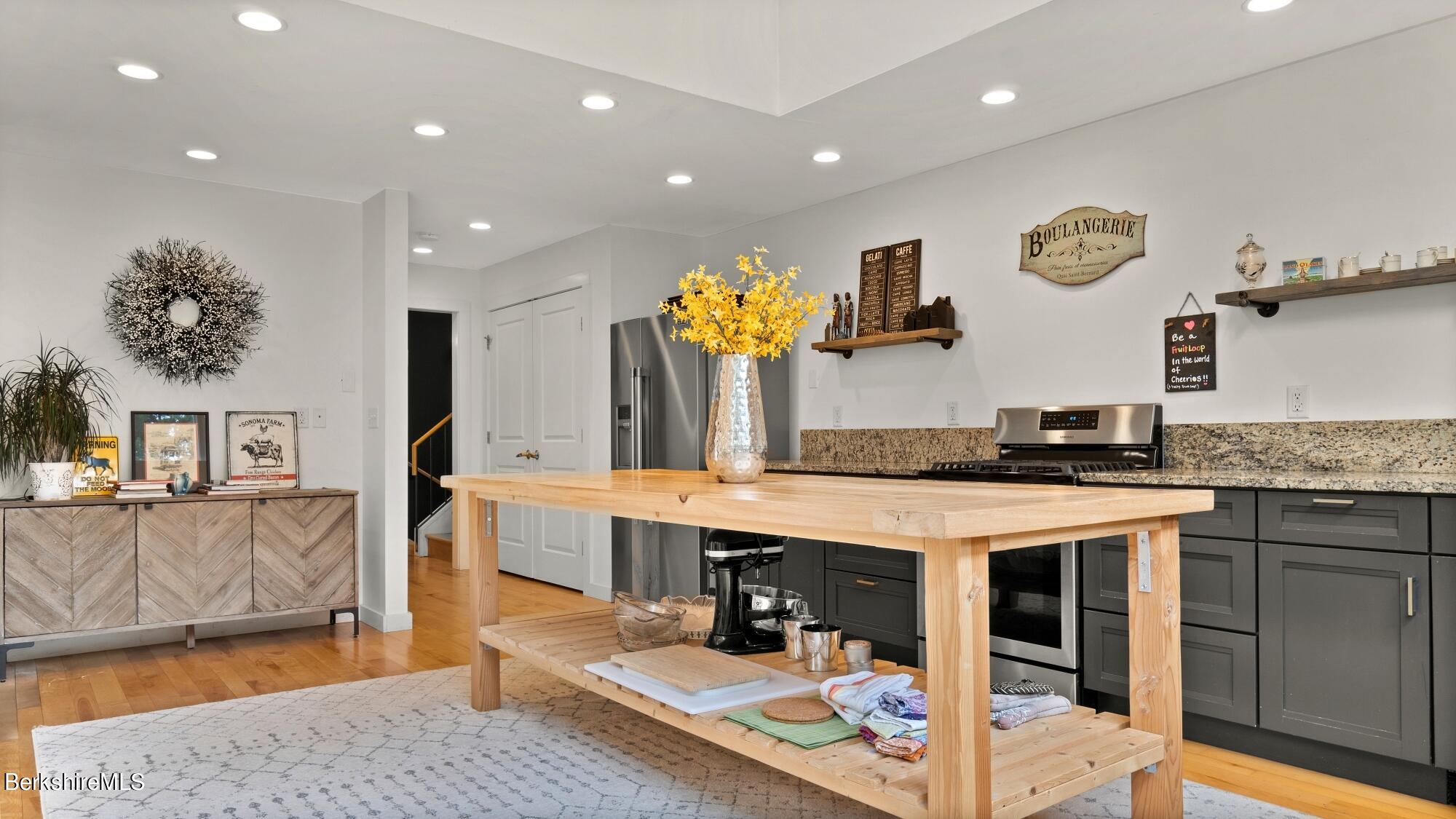 16 Squaw Peak Road Great Barrington, MA 01230 - Photo 5 of 38 a kitchen with stainless steel appliances granite countertop a stove and cabinets