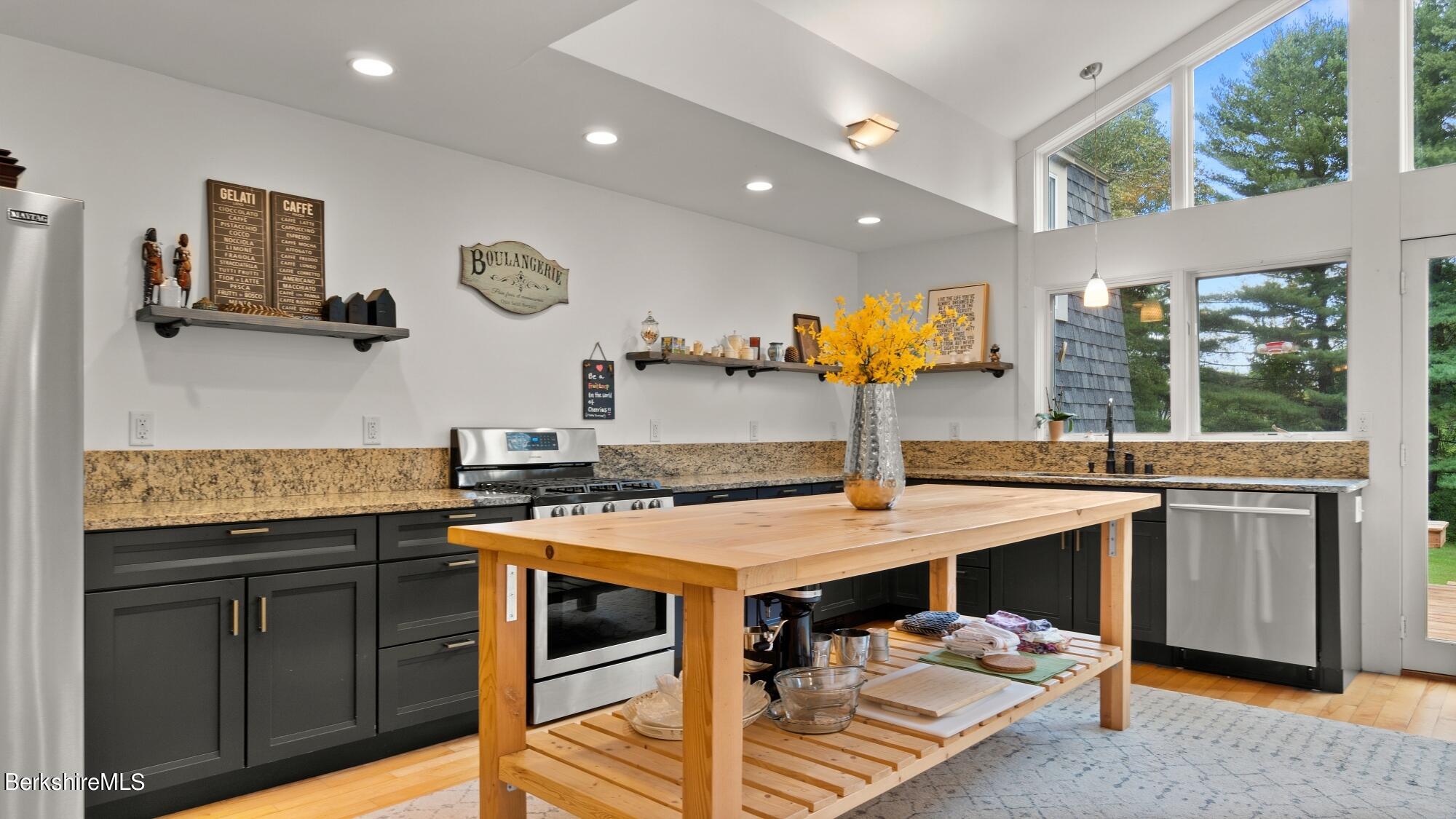 16 Squaw Peak Road Great Barrington, MA 01230 - Photo 7 of 38 a kitchen with stainless steel appliances granite countertop a sink and a stove