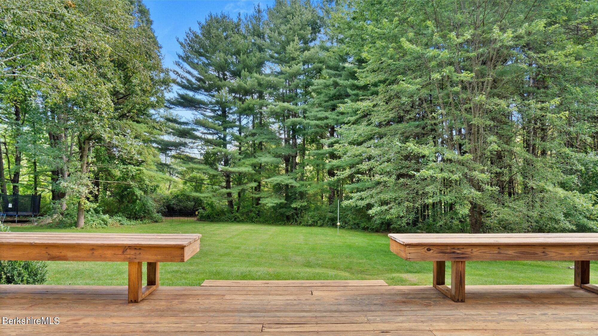 16 Squaw Peak Road Great Barrington, MA 01230 - Photo 9 of 38 a view of a yard tables and a bench